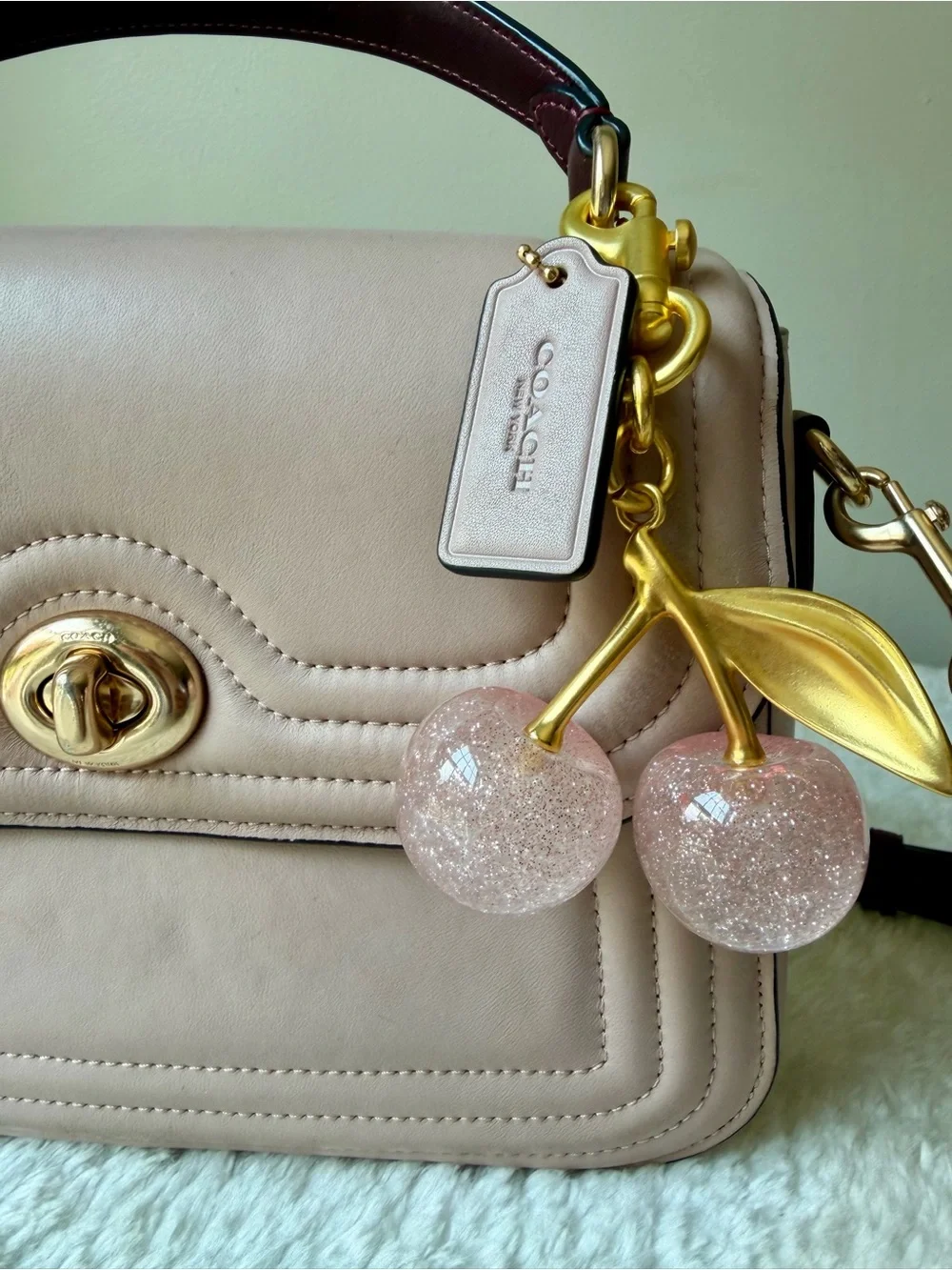 Coach Marlie Top Handle bag  Quilted Leather in pink with charm